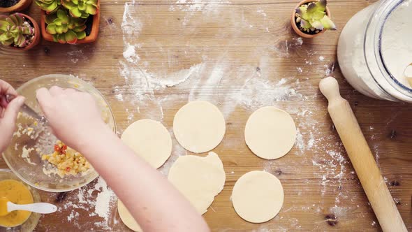 Flat lay. Step by step. Rolling dough for home made empanadas.