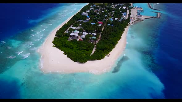 Aerial drone seascape of beautiful coast beach holiday by blue ocean with white sand background of a