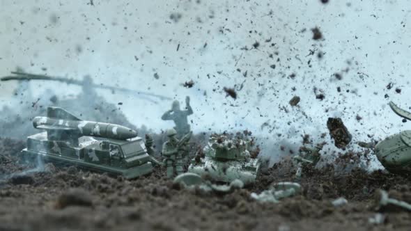 War scene with military toys after explosions, Ultra Slow Motion