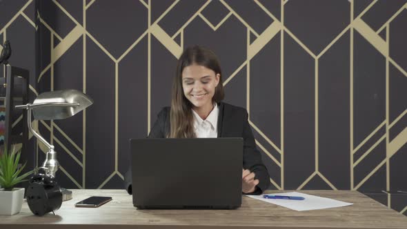 Smiling western business woman, white person working from home with computer notebook laptop