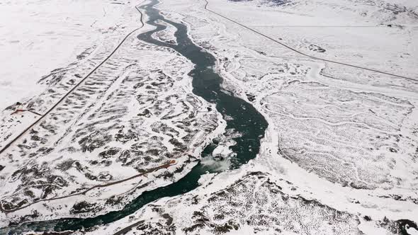 Goðafoss Waterfall and River Skjálfandafljót in North Iceland in Winter, Aerial View of Famous Touri