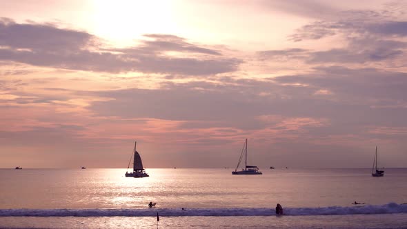 Sail boat in tropical sea at beautiful sunset or sunrise sky