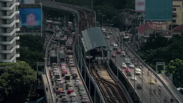 Time Lapse Shot of Multi-level Traffic Road, Railway and Train Station. Bangkok, Thailand