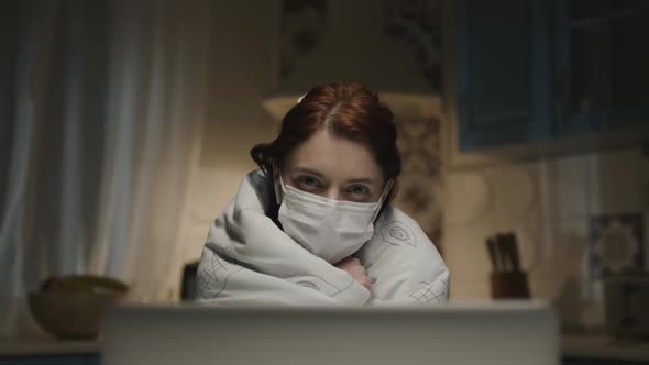 Young Girl In The Kitchen With Laptop, Young Woman Working Remotely At Home Because Of Pandemic