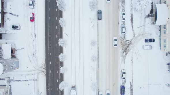 Aerial Top Down View of Snowy City Asphalt Road Landscapes in Winter