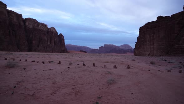 Wadi Rum Desert Early In The Morning With Clouds And Mountains Visible In The Background