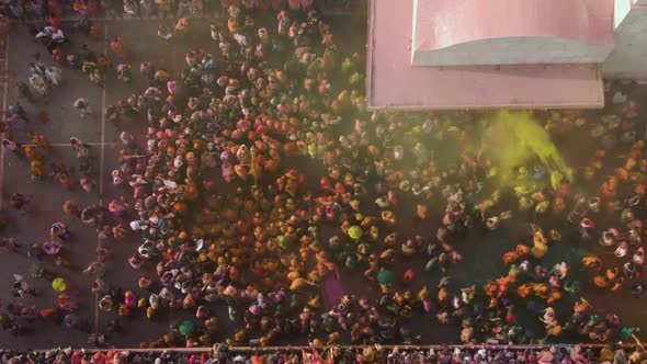 Color battle at the holi festival in India, 4k aerial shot