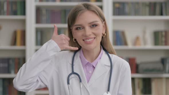 Portrait of Lady Doctor Showing Call Me Sign