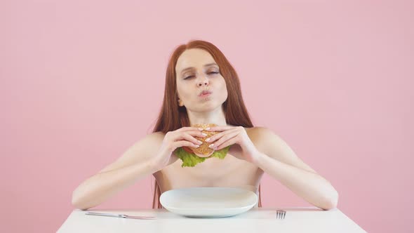 Happy Skinny Girl Breaks the Diet and Eats a Burger. Violation of Diet. Anorexia