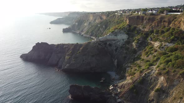 Aerial View From Above on Azure Sea and Volcanic Rocky Shores