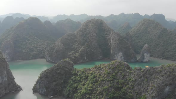 Aerial: unique flying over Ha Long Bay, famous tourism destination in Vietnam