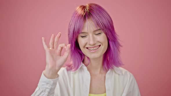 Dyed Pinkhaired Woman Shows Confidence Smiling Closeup