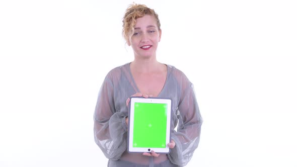 Happy Beautiful Blonde Woman Talking While Showing Digital Tablet