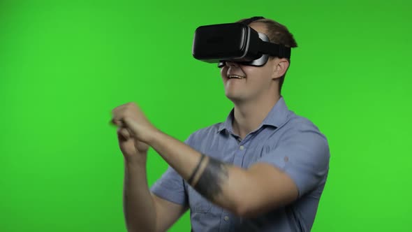 Man Using VR Headset Helmet To Play Game. Watching Virtual Reality 3d 360 Video. Chroma Key