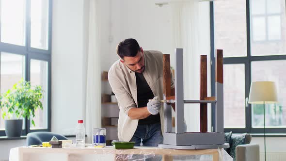 Man Painting Old Wooden Table in Grey Color