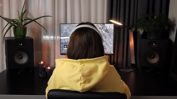 Female gamer playing in first-person shooter online video game