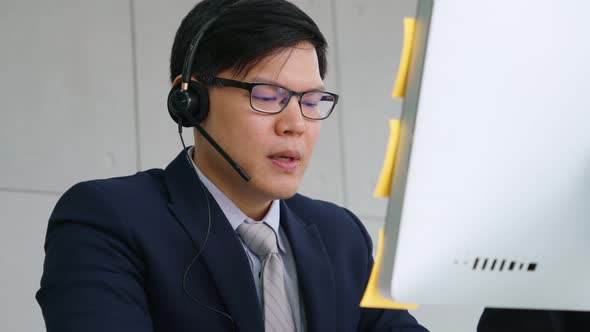 Business People Wearing Headset Working in Office