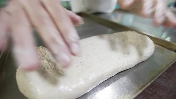 Chef Shaping a Loaf of Bread