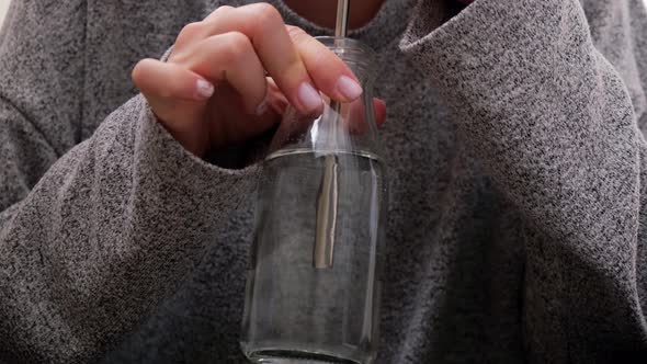 Young Millennial Blonde Woman Drinking Water From Eco Bottle with Metal Reusable Straw Tube and