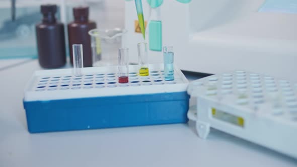 Close-up Chemist Mixed Up Chemicals Using a Micropipette.