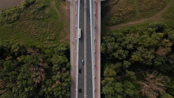 Aerial Birds Eye Overhead Top Down Panning View of Modern Road Bridge Over River