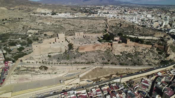 Impressive fortified citadel on hilltop - Almeria Alcazaba; drone arc