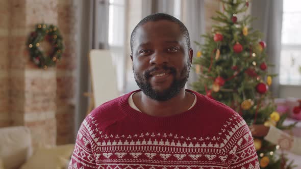 Portrait of Positive Black Man at Home on Christmas Day