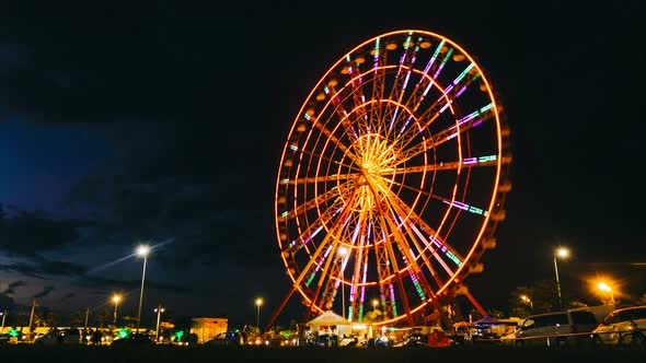 Time Lapse Ferris Wheel on a Sunset Background on the Sea