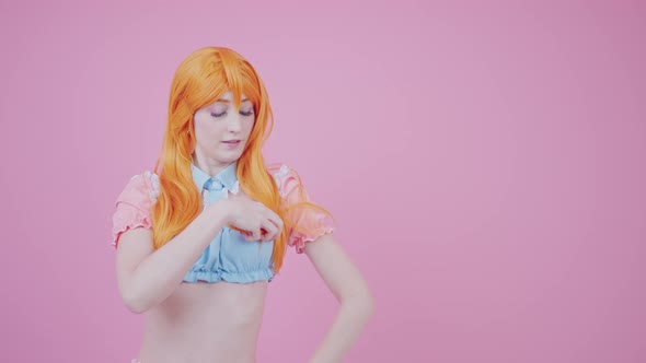 Feminine Gingerhaired Girl in Her 20s Posing with Her Shiny Healthy Hair Isolated Pink Background