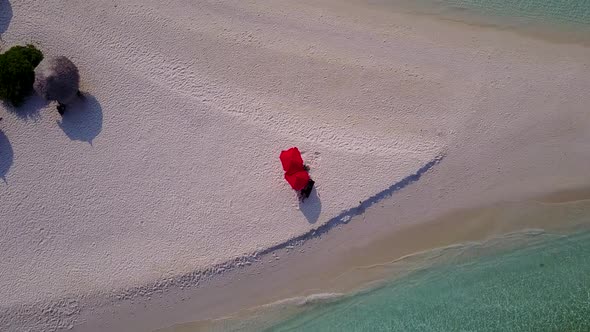 Drone tourism of island beach by water with sand background