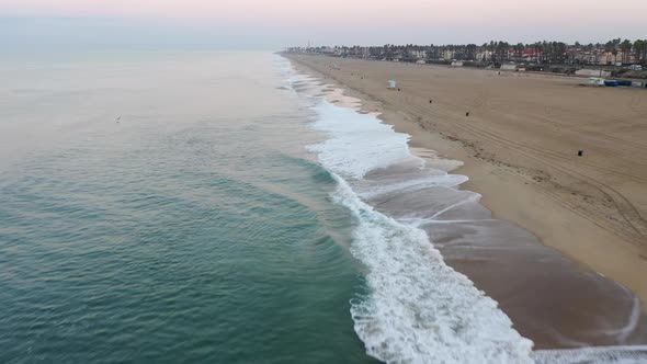 A stunning 4k view of the crystal clear blue waters of sunny Surf City USA Southern California as ca