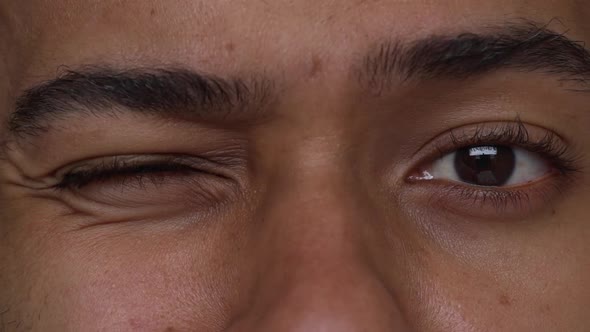 Extreme Close Up Expressive Eyes of Young Man Playing with Eyebroews Slow Motion