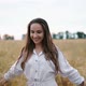 A Young Girl Happily Walking in Slow Motion Through a Field Touching with Hand Wheat Ears Beautiful - VideoHive Item for Sale