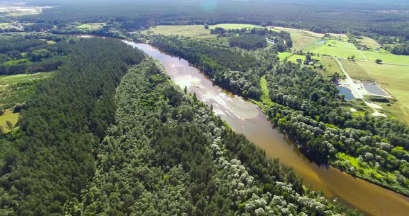 4K - River in the forest. Aerial view