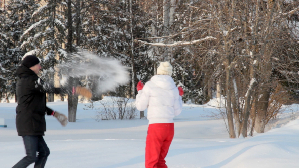 Happy Couple Throwing Snowballs alt