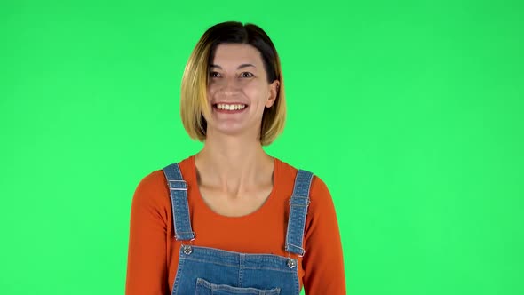 Happy Woman Waving Hand and Showing Gesture Come Here. Green Screen