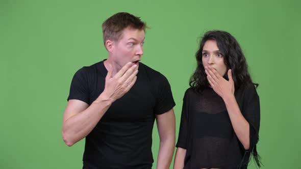 Young Couple Looking Shocked Together