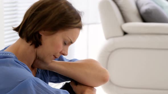 Sad woman sitting on the floor