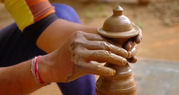 Skilled Hands of Potter Shaping the Clay on Potter Wheel and Sculpting Clay Pot Jar, Shilpagram