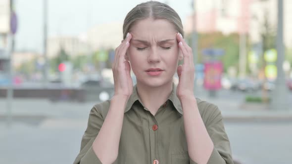 Distressed Woman with Headache Outdoor