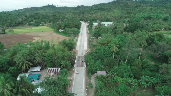 Aerial Drone Shot of Concrete Road in a Small Farming Community, Aerial View of Countryside Road