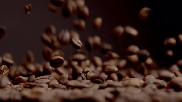 Closeup Coffee Beans Fall on Heap