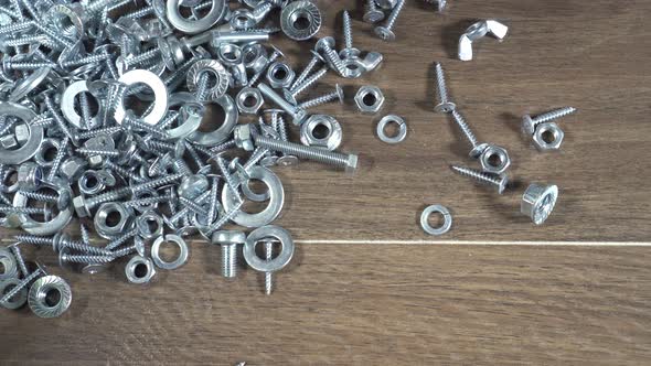 View Bolts Nuts Screws on the Table Closeup