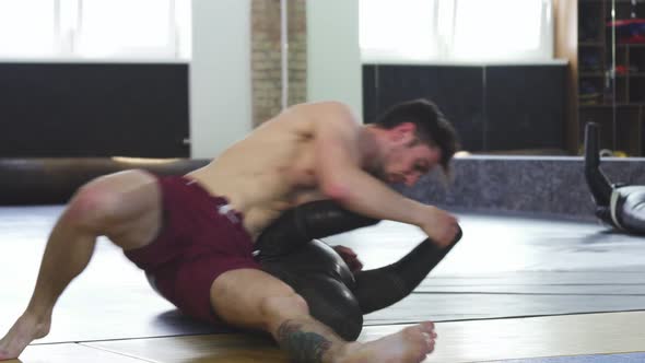 Shirtless Male Wrestler or Grappler Doing Side Control Movement Drill