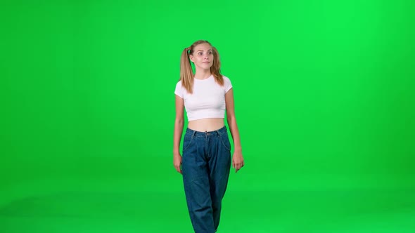 Young Woman Walking Down the Street on a Green Background a Passerby on a Walk Chroma Key Template