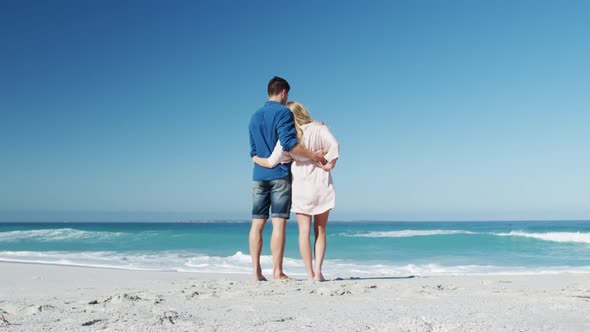 Couple in love enjoying free time on the beach together