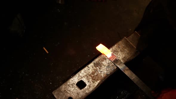 Blacksmith working on a iron rod