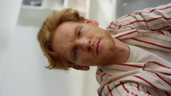 Serious Guy Looking Webcam Talking with Friend Closeup