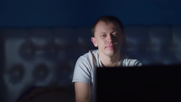 Young Man Watching TV Late at Night Switching Channels Camera Movement