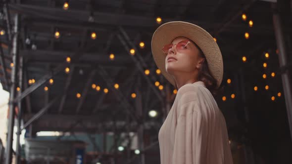 Attractive young girl on the background of lights in New York